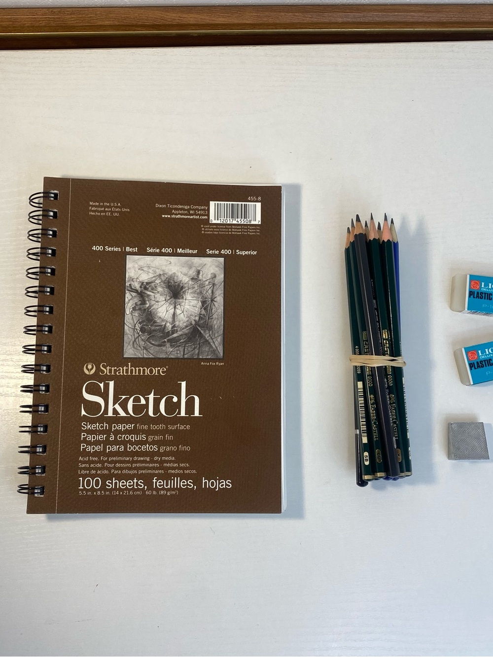 5.5in x 8.5in sketch book with erasers and pencils